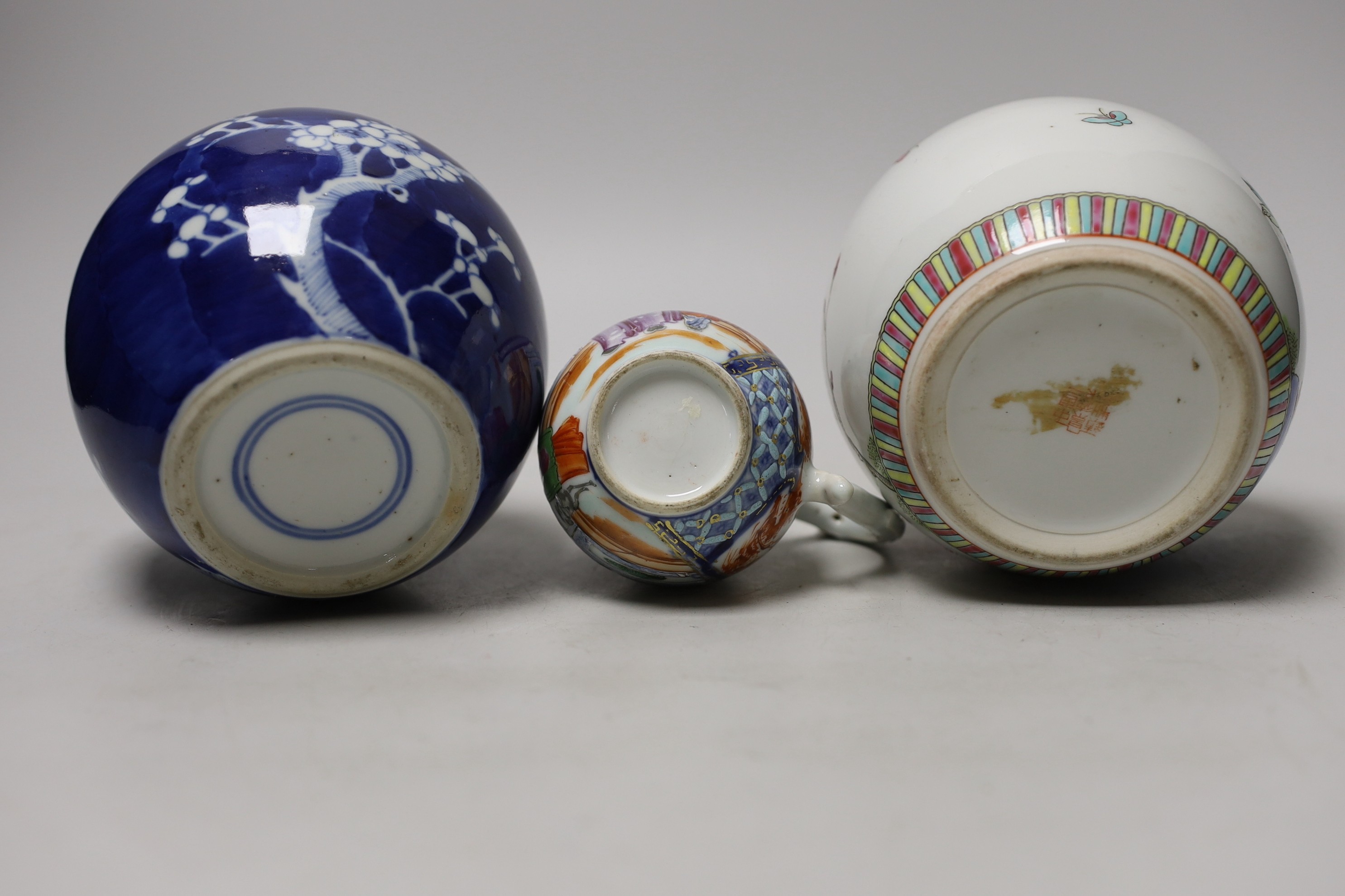 A Chinese famille rose Mandarin sparrow beak jug, Qianlong period, 10.5cm high and two 20th Centry porcelain jars